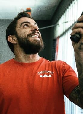 Real Training coach smiling on the gym floor