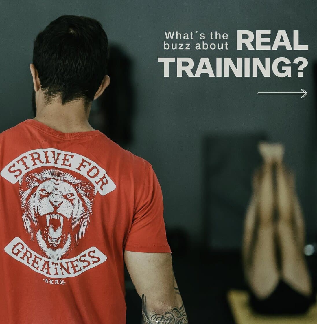Real Training athlete wearing the gym's lion shirt